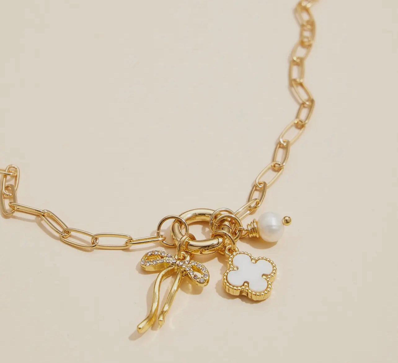 Gold Dipped Bow Charm Necklace with Clover and Pearl